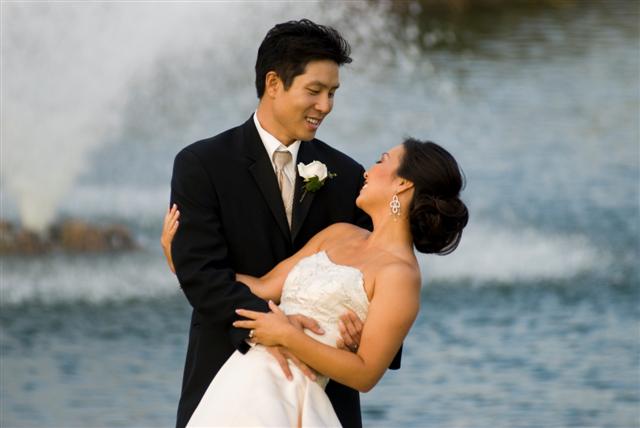 Happy couple by the fountain.  I've photographed many very beautiful Asain brides at this facility.